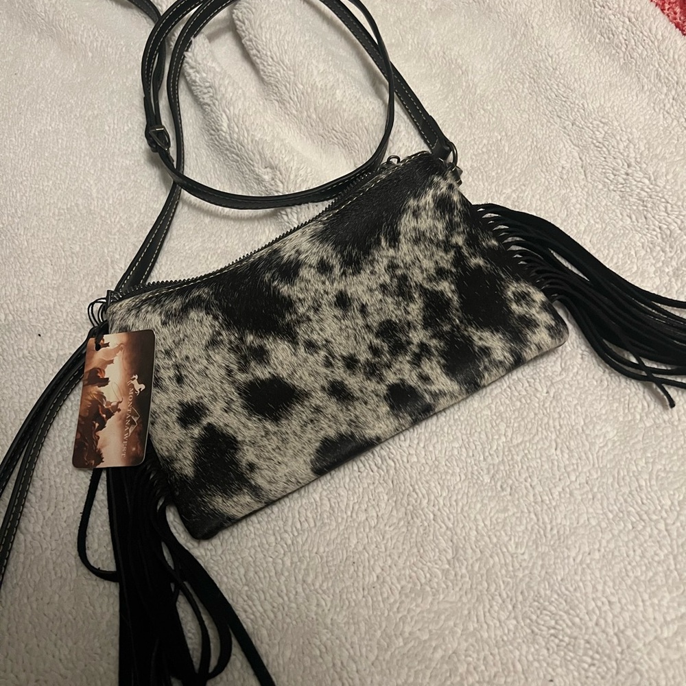 Black and White Crossbody Bag with Unique Pattern and Decorative Tassel